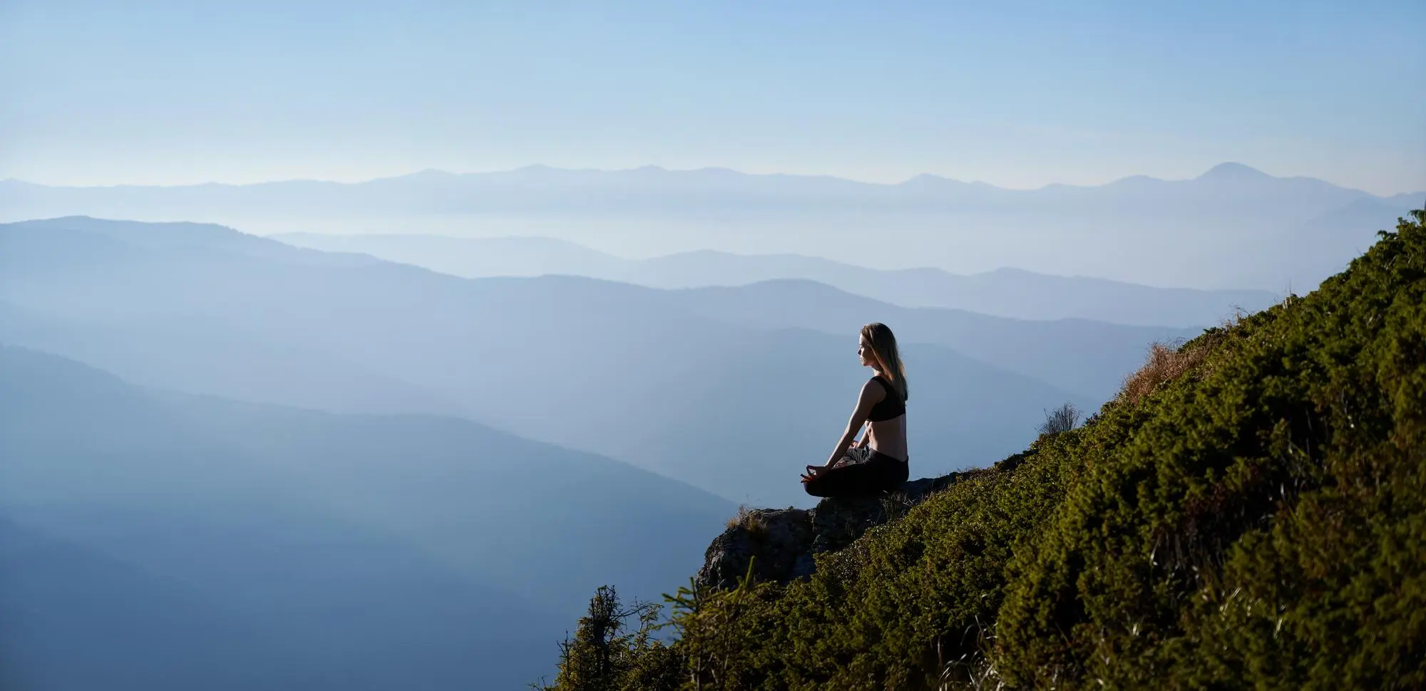 Meditating Woman on Mountain